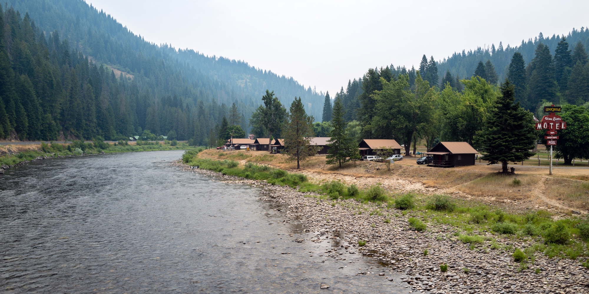 Multiple cabins next to a calm section on the Lochsa river just outside of Kooskia, Idaho. 